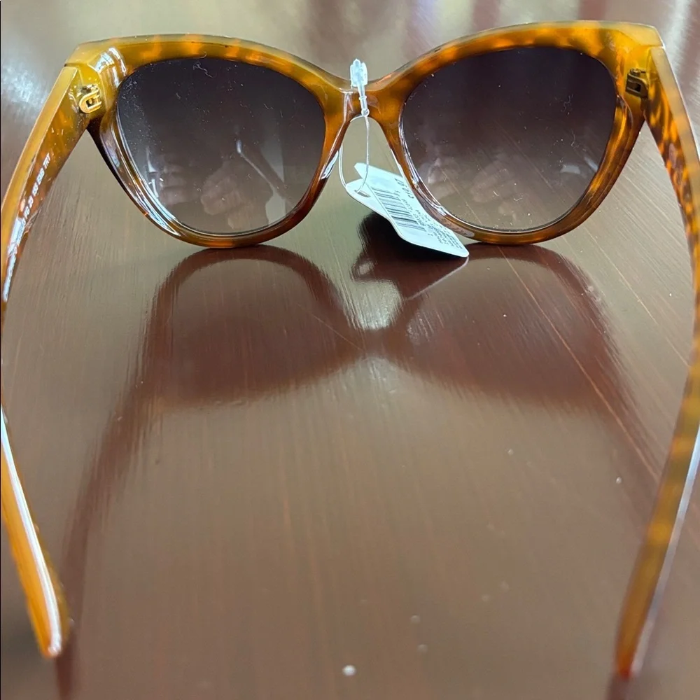 Foster Grant 100% UVA-UVB protection leopard print, gold tone beaded frame edge
